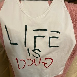 Used life is Gucci bodysuit (not authentic)
